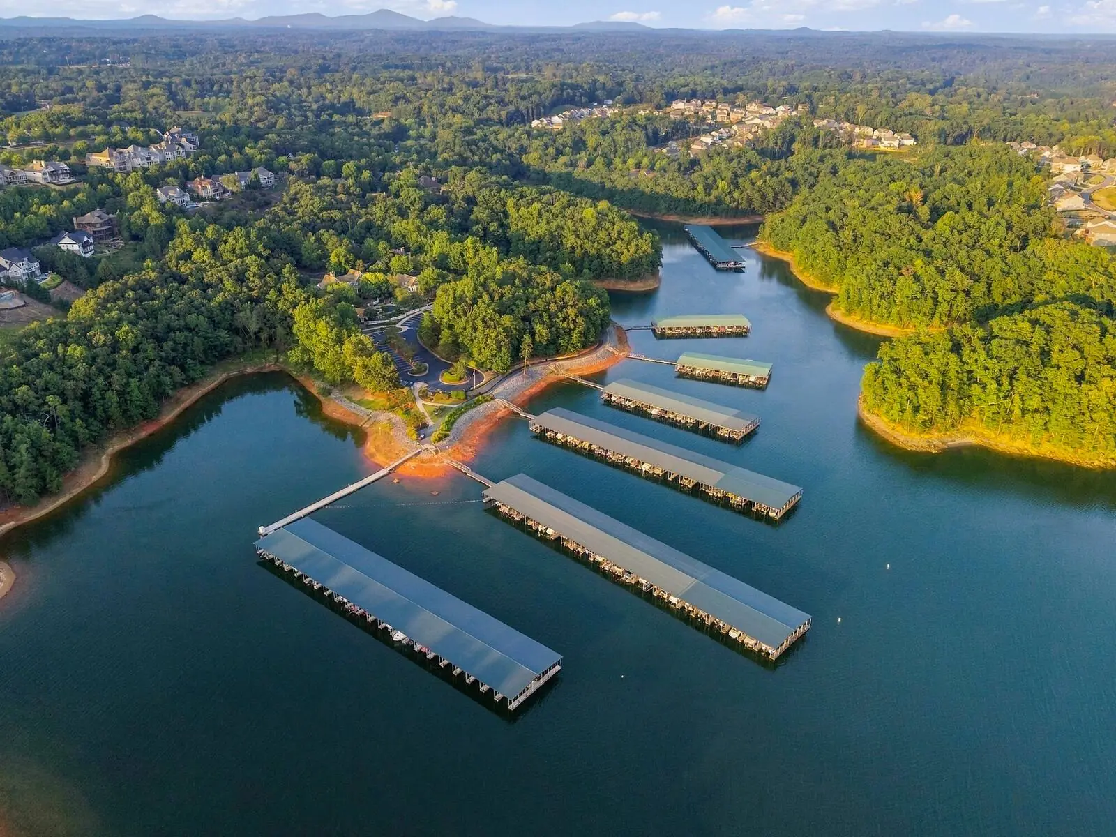 Aerial view of a marina and docks at golden hour