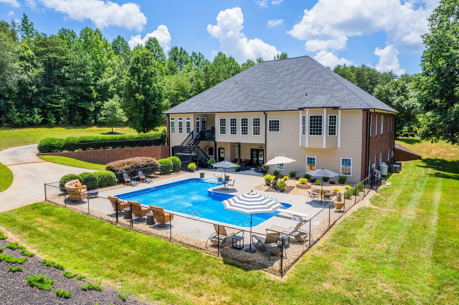 Aerial view of a luxury home with a pool